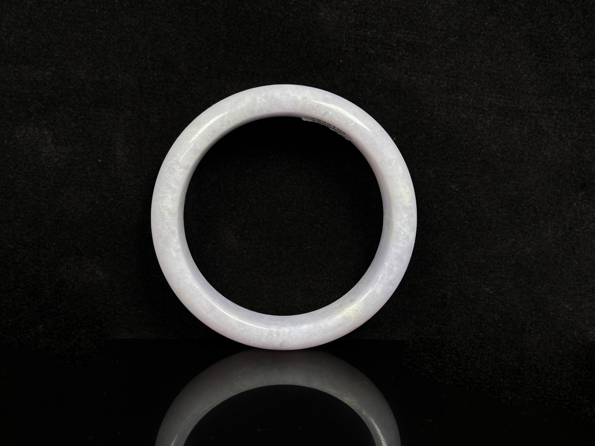 A violet white jadeite bangle.