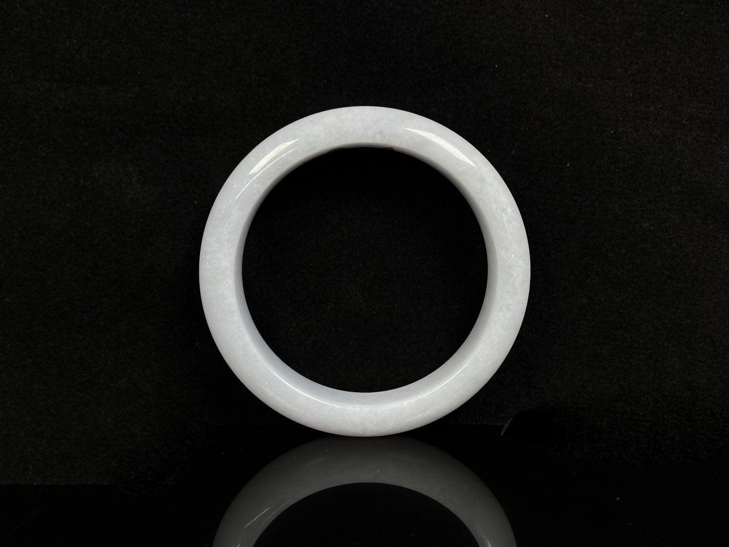 A violet white jadeite bangle.