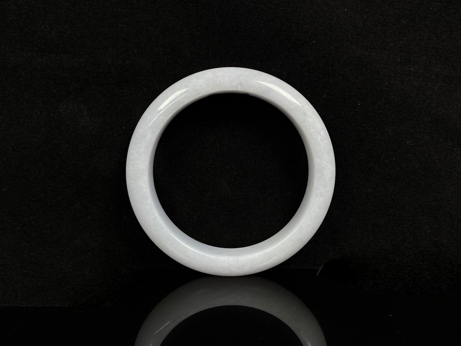 A violet white jadeite bangle.