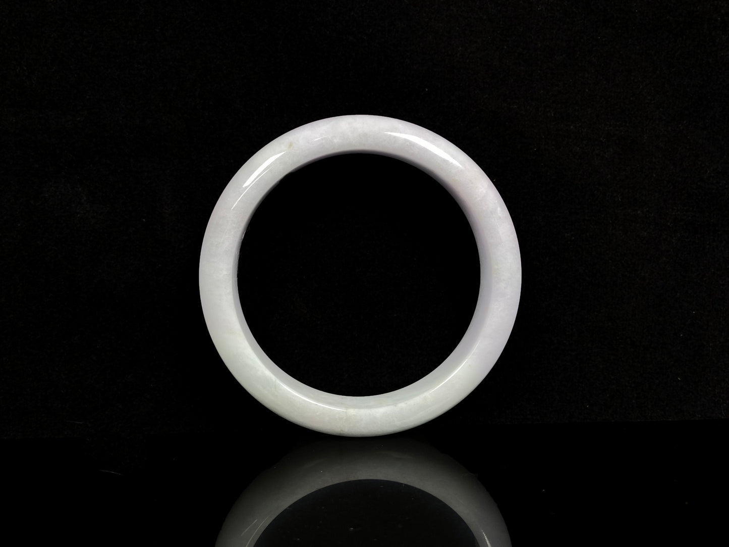 A violet white jadeite bangle.