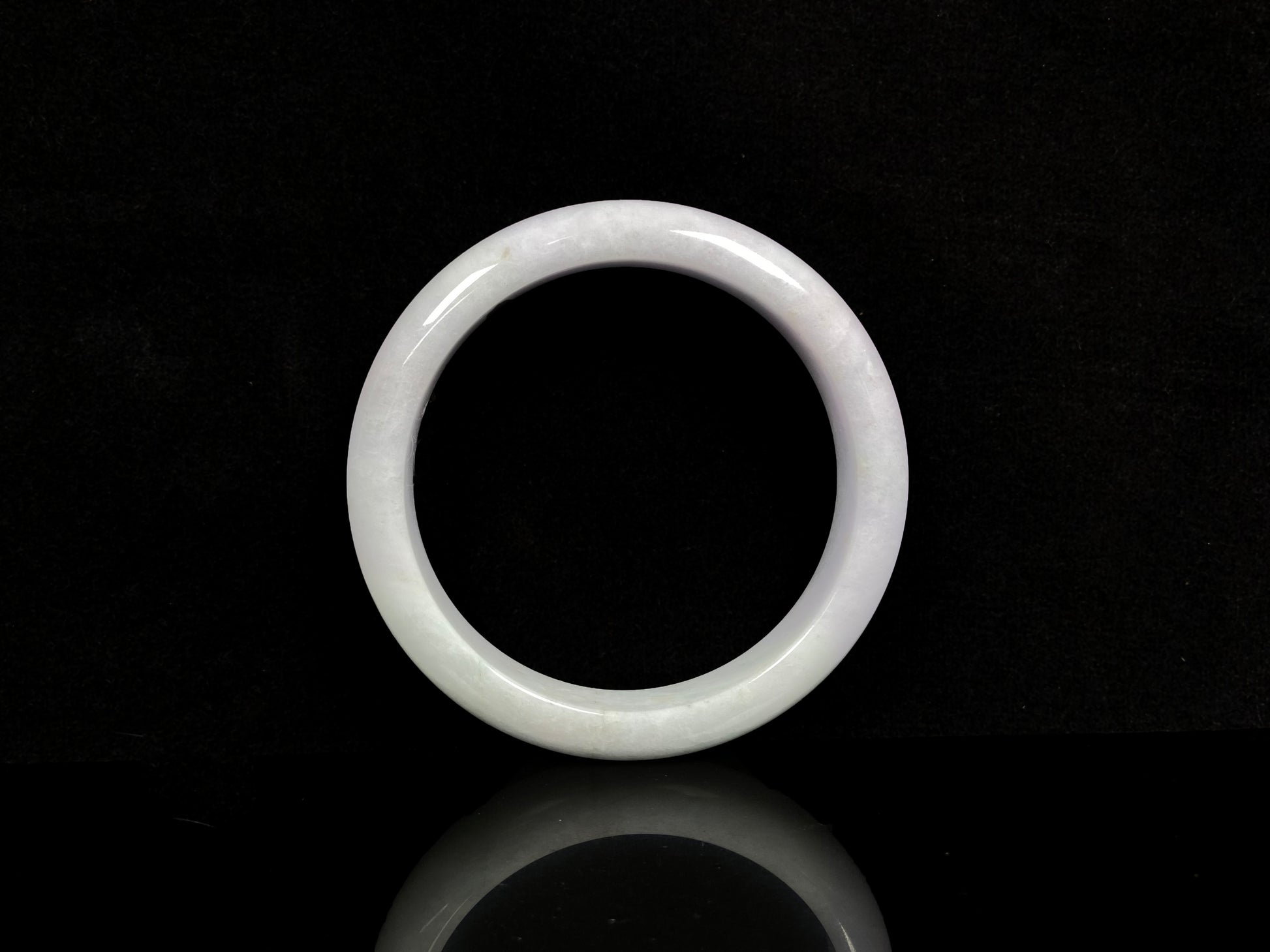 A violet white jadeite bangle.