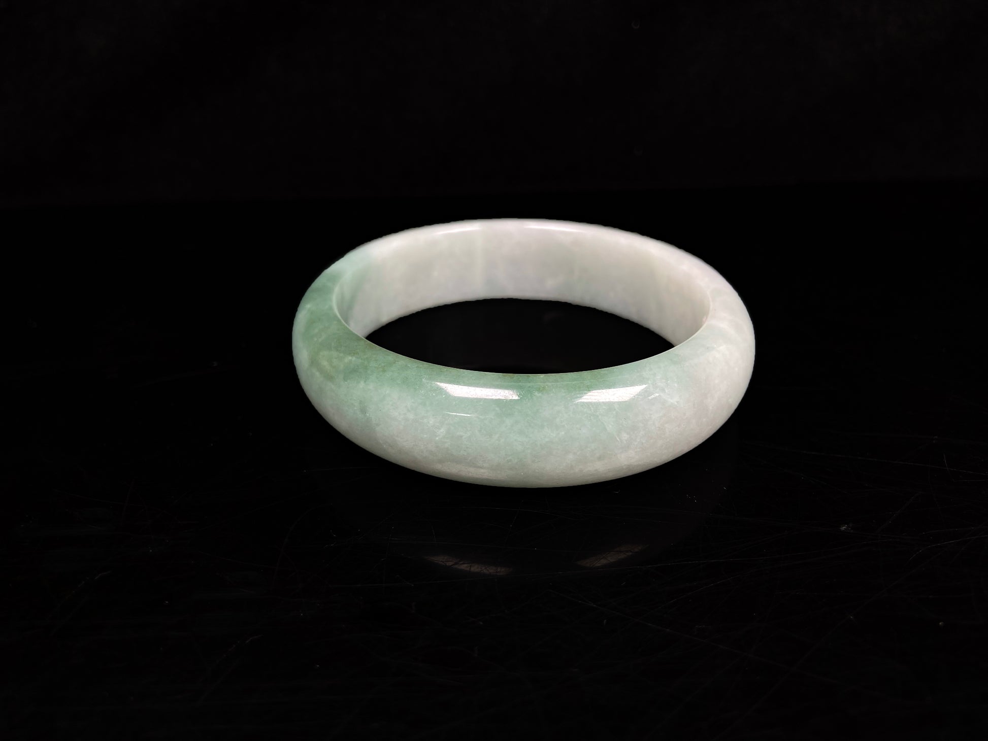 A fresh green with cloud white jadeite bangle.