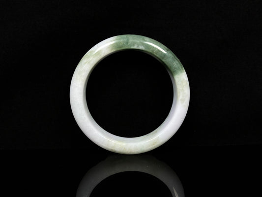A creamy white green  jadeite bangle.