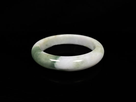A creamy white green  jadeite bangle.