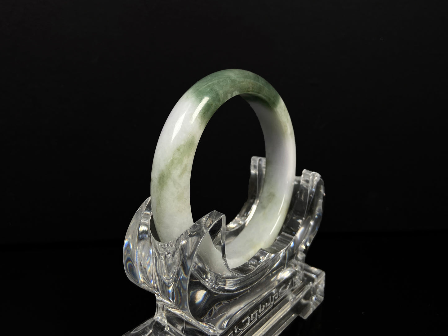 A creamy white green  jadeite bangle.