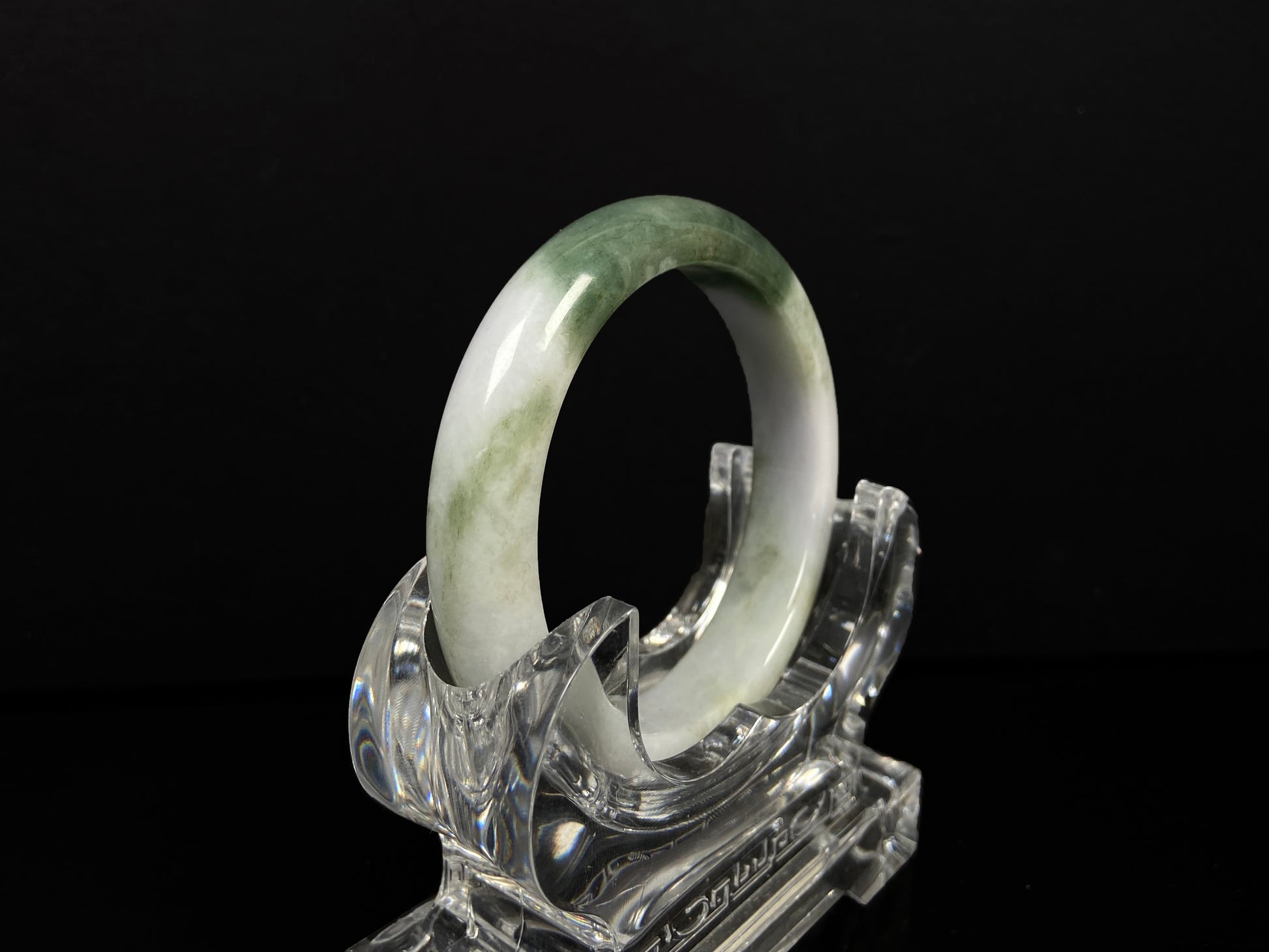 A creamy white green  jadeite bangle.