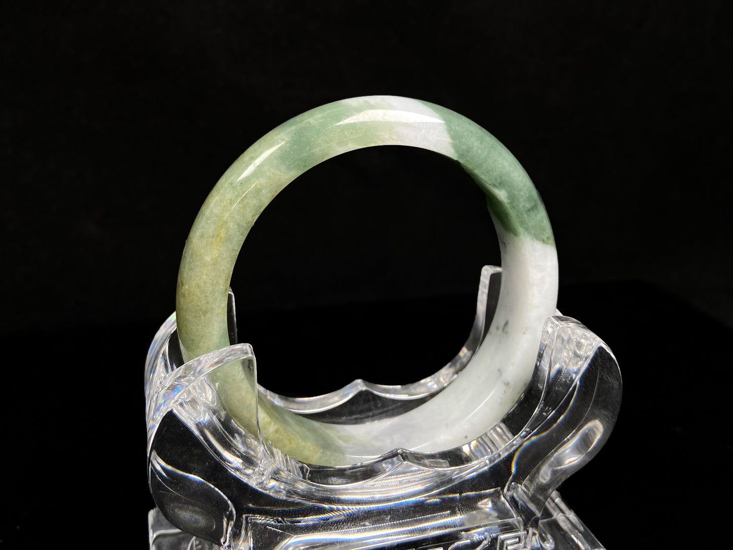 A verdant gold silken white  jadeite bangle.