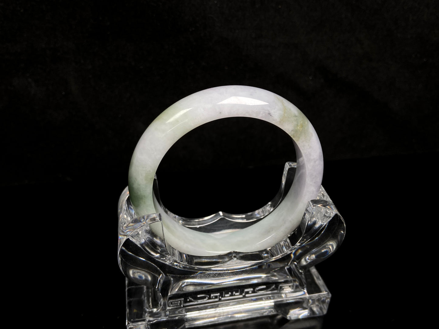 A pearl moss drift jadeite bangle.