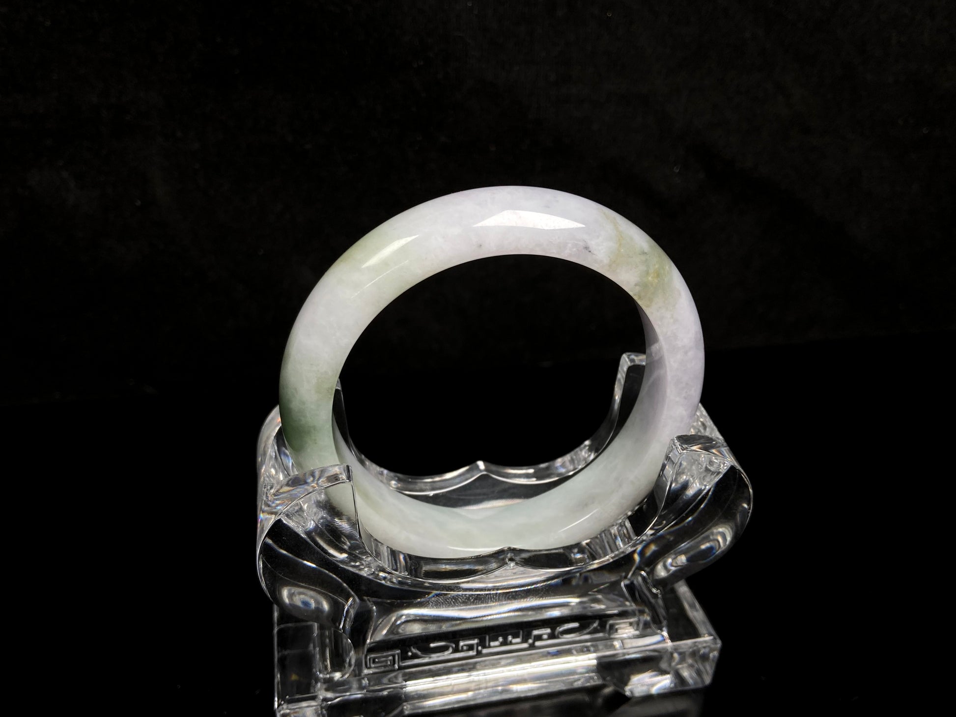 A pearl moss drift jadeite bangle.