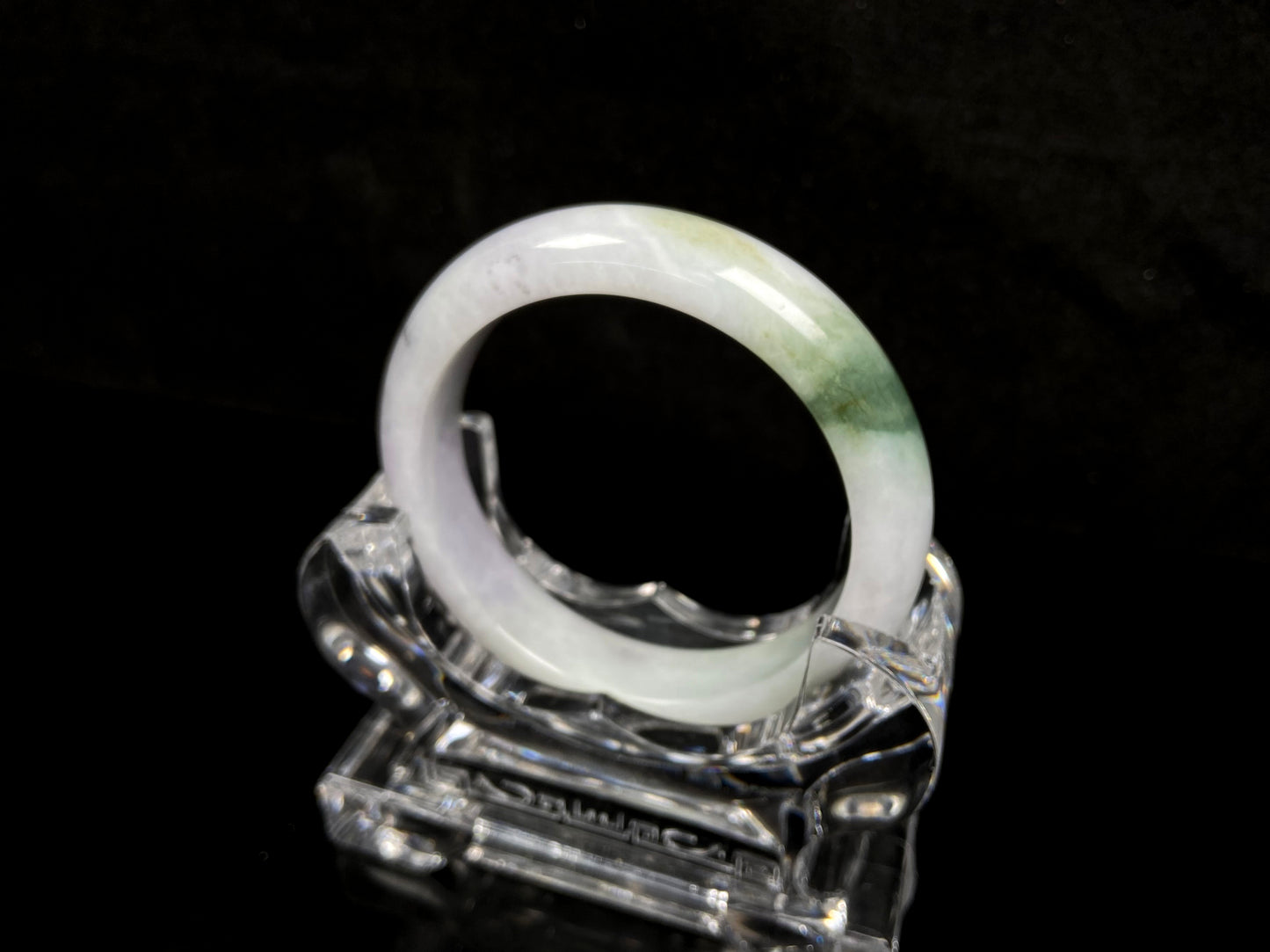 A pearl moss drift jadeite bangle.