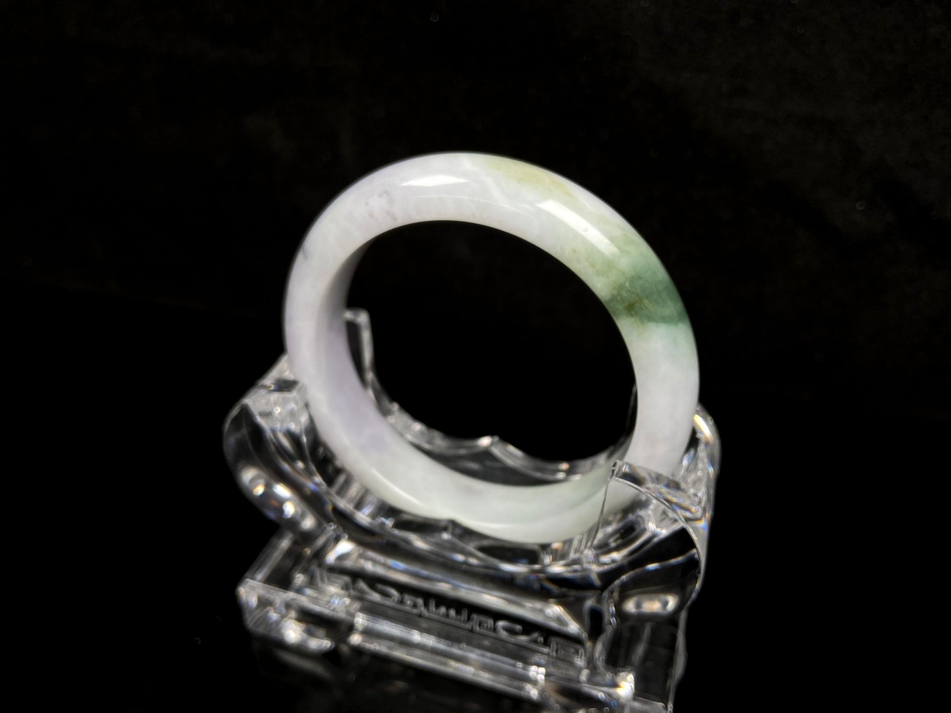 A pearl moss drift jadeite bangle.