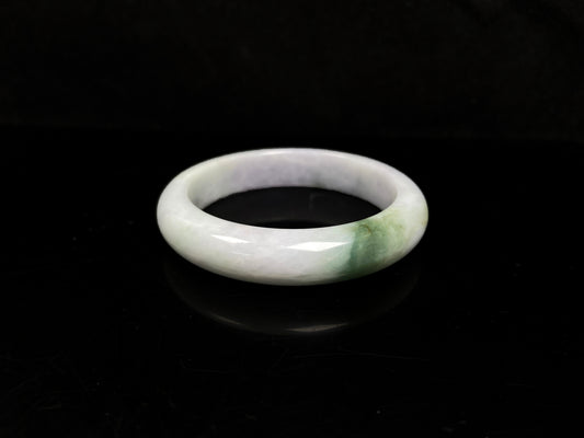 A pearl moss drift jadeite bangle.