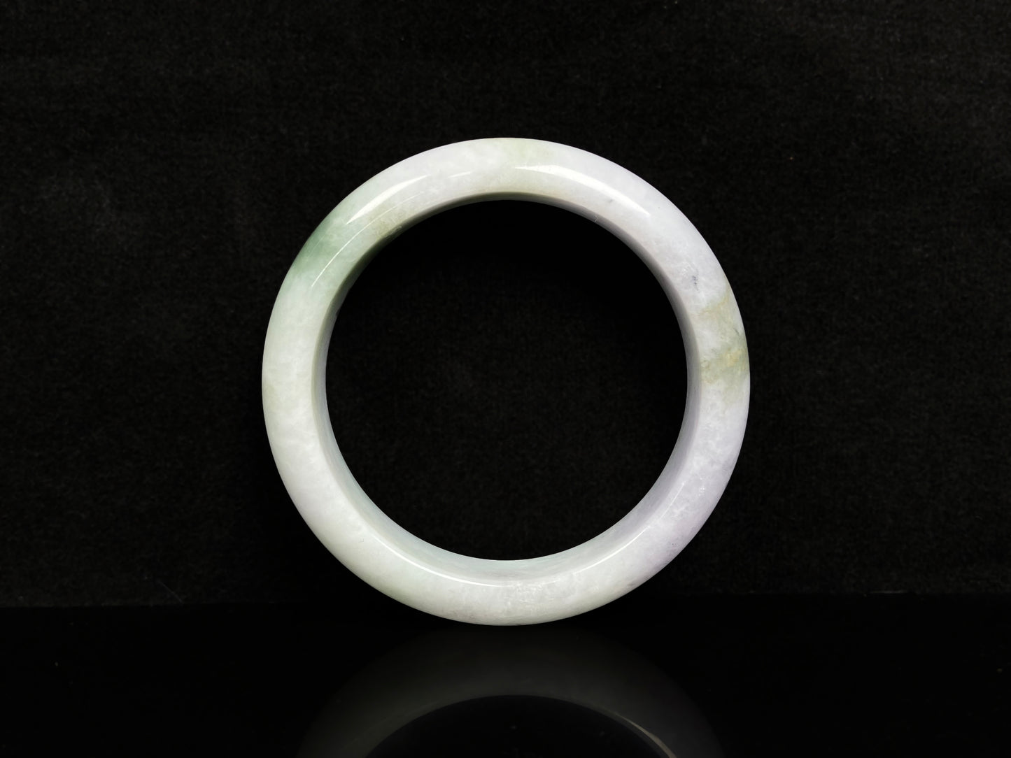 A pearl moss drift jadeite bangle.
