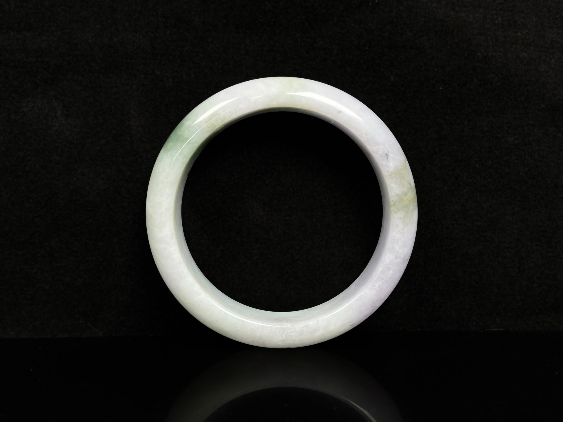 A pearl moss drift jadeite bangle.