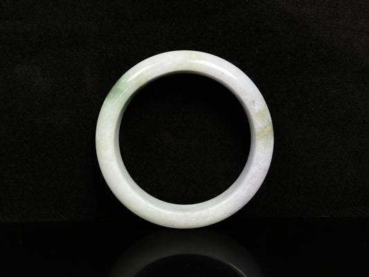 A pearl moss drift jadeite bangle.