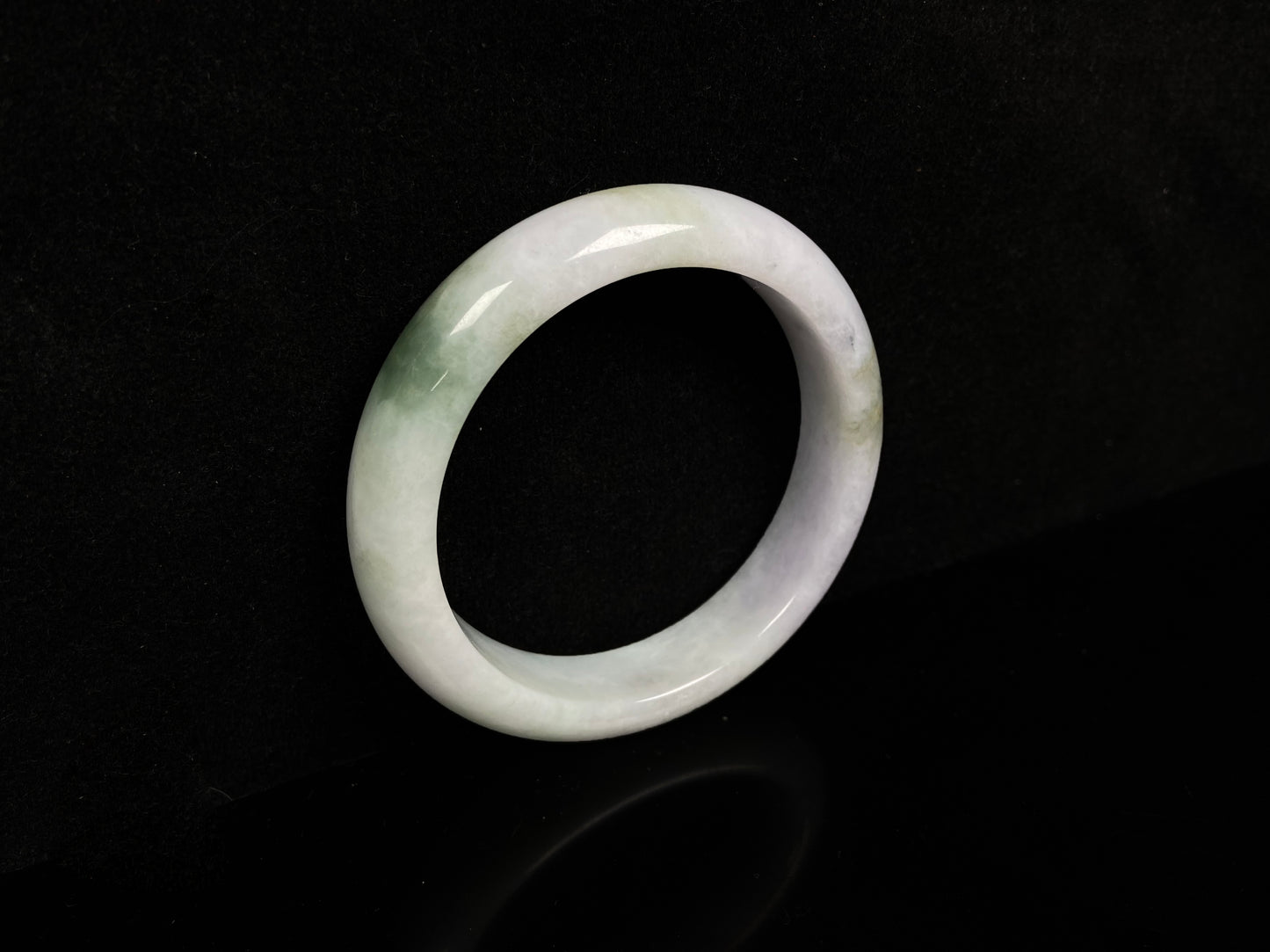A pearl moss drift jadeite bangle.