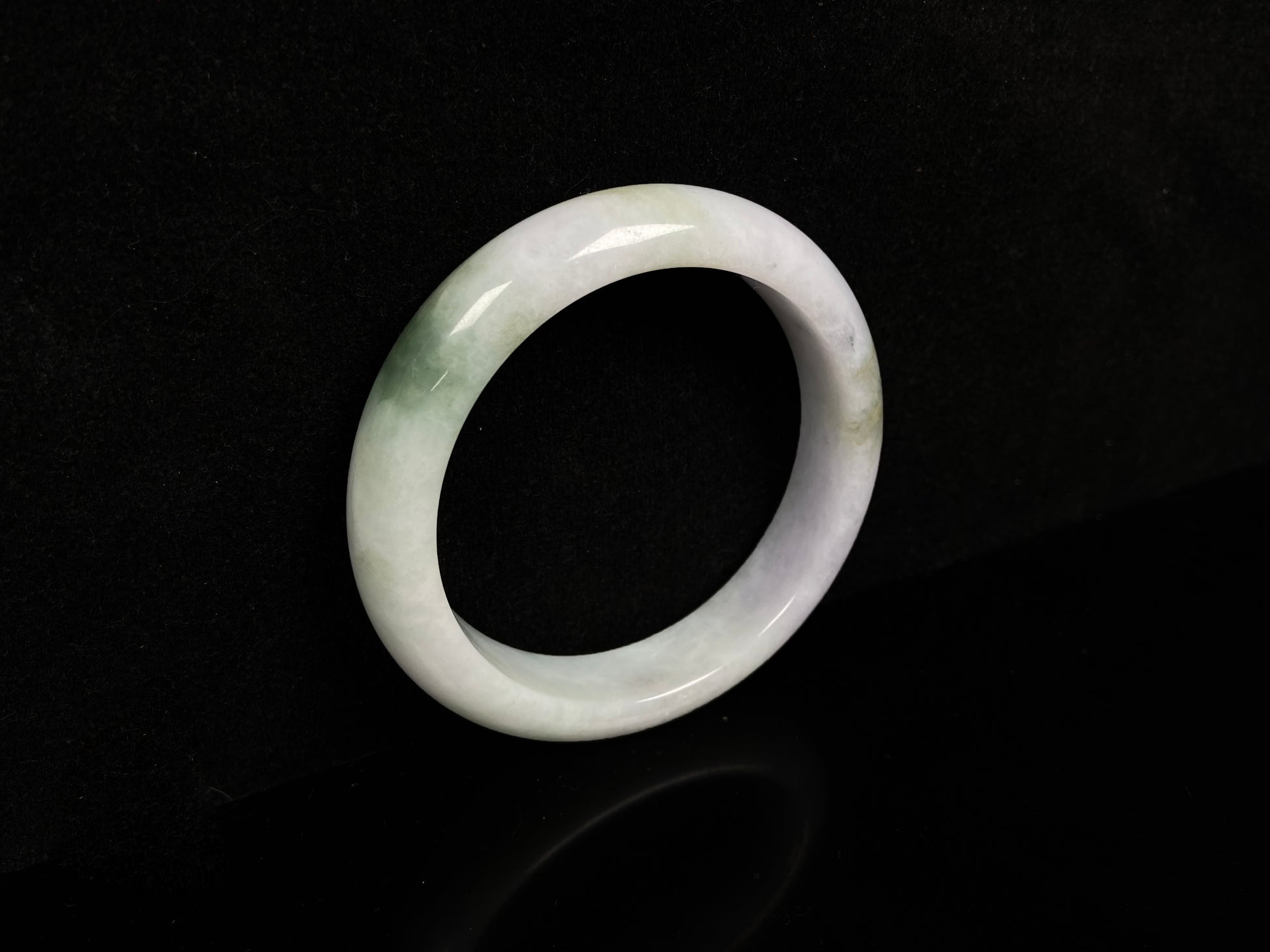 A pearl moss drift jadeite bangle.
