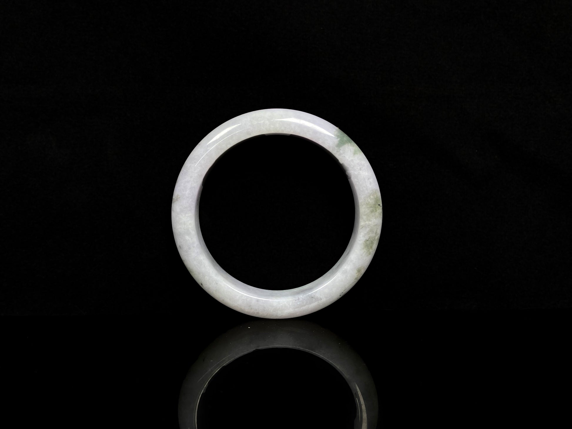A mossy cloud hush jadeite bangle.