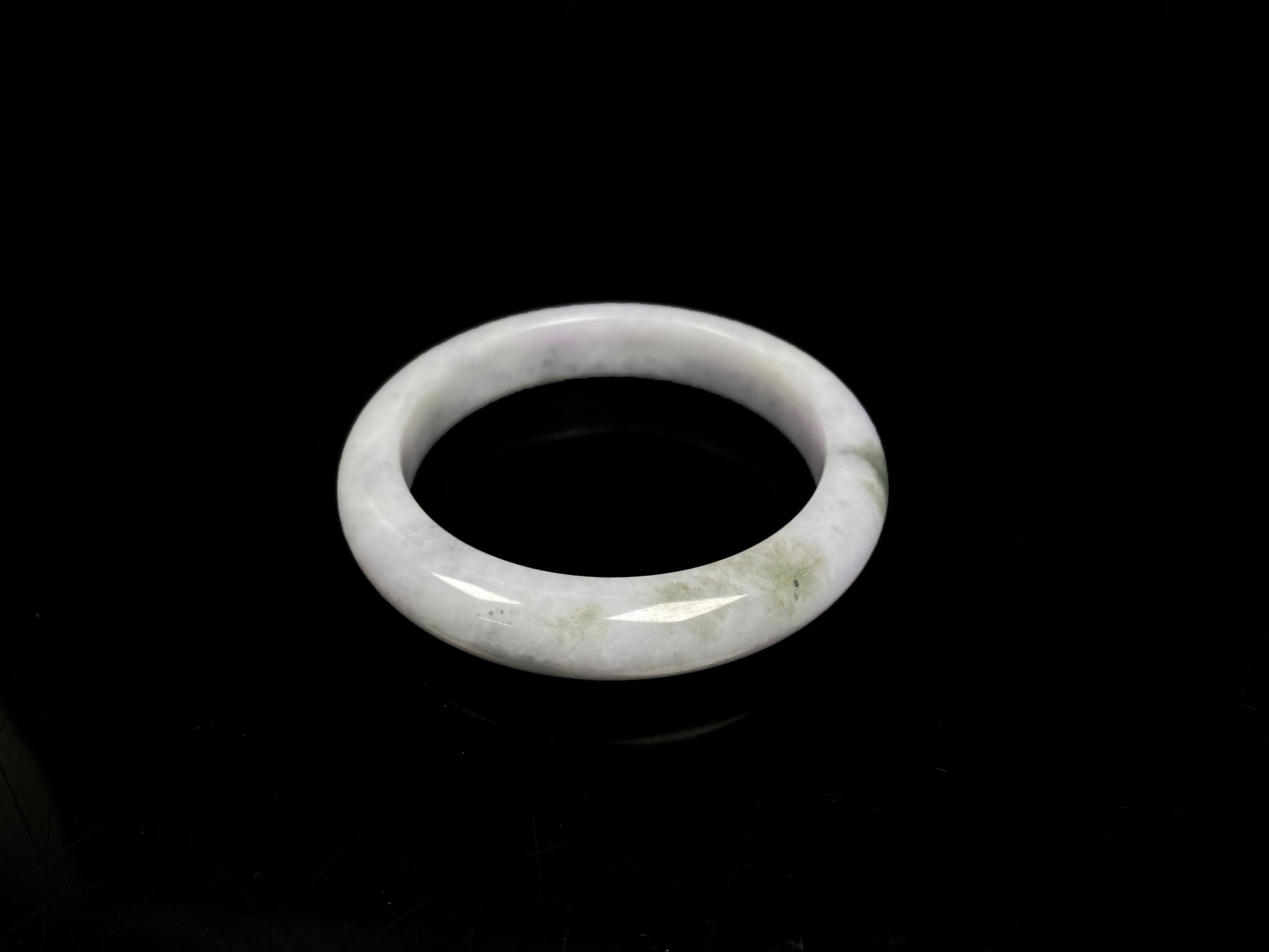 A mossy cloud hush jadeite bangle.