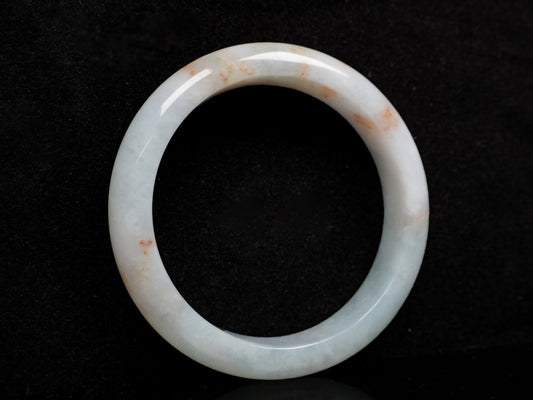 A red speckle green base  jadeite bangle.