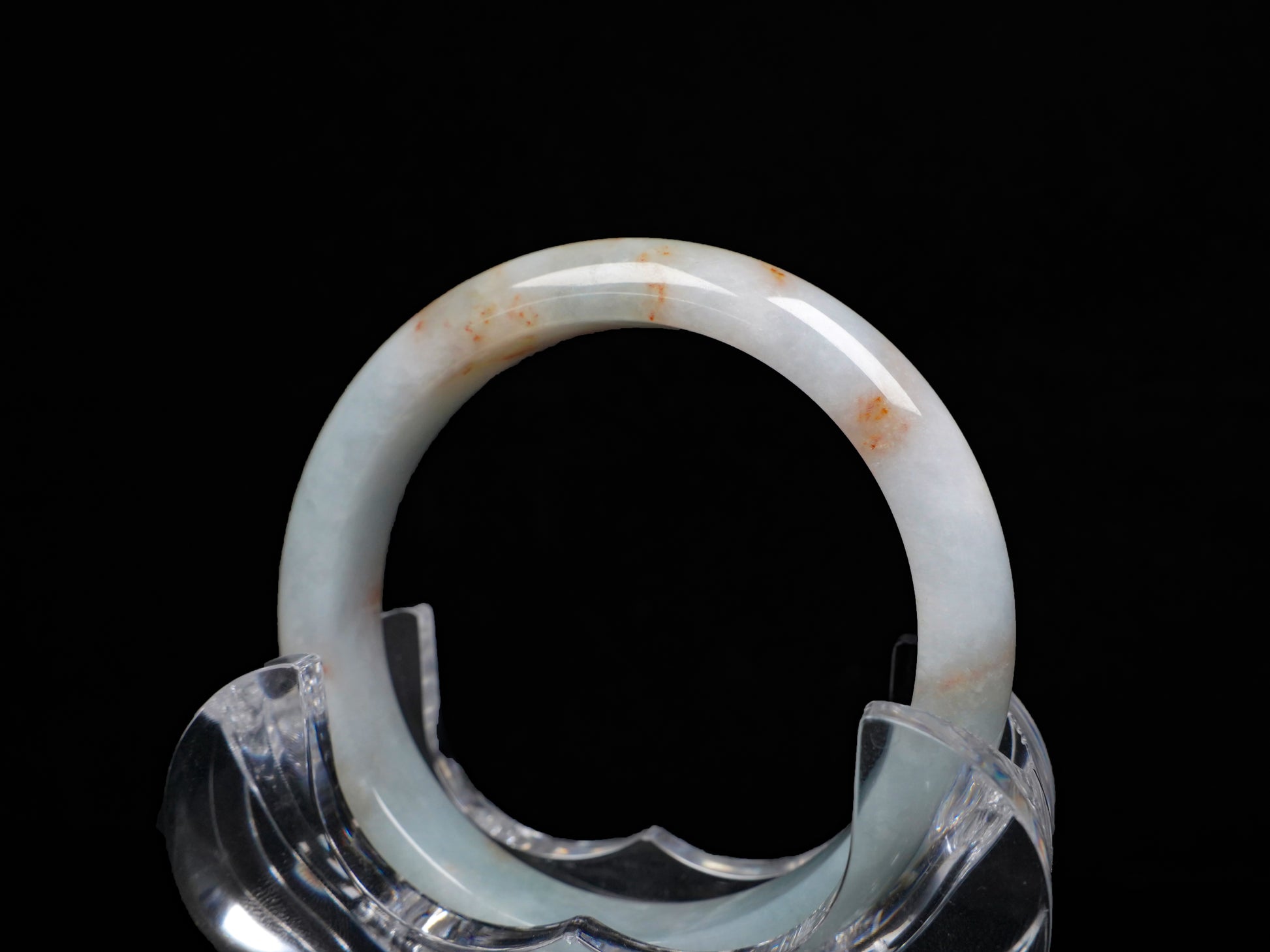 A red speckle green base  jadeite bangle.