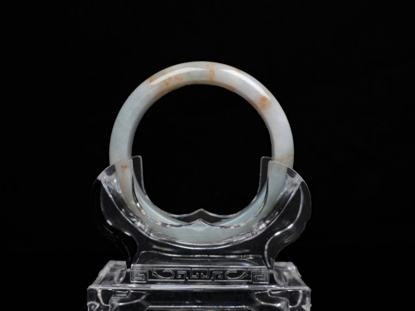 A red speckle green base  jadeite bangle.