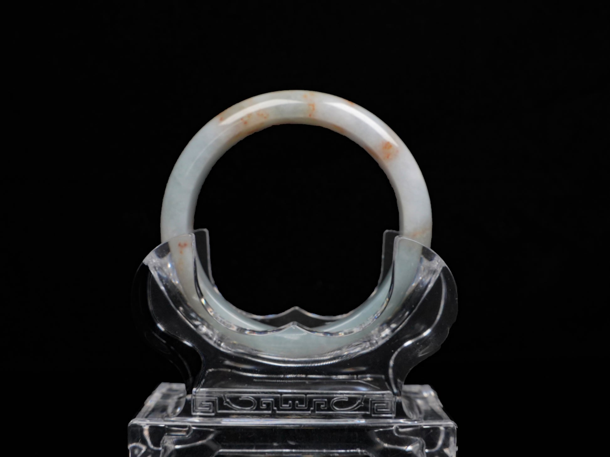 A red speckle green base  jadeite bangle.