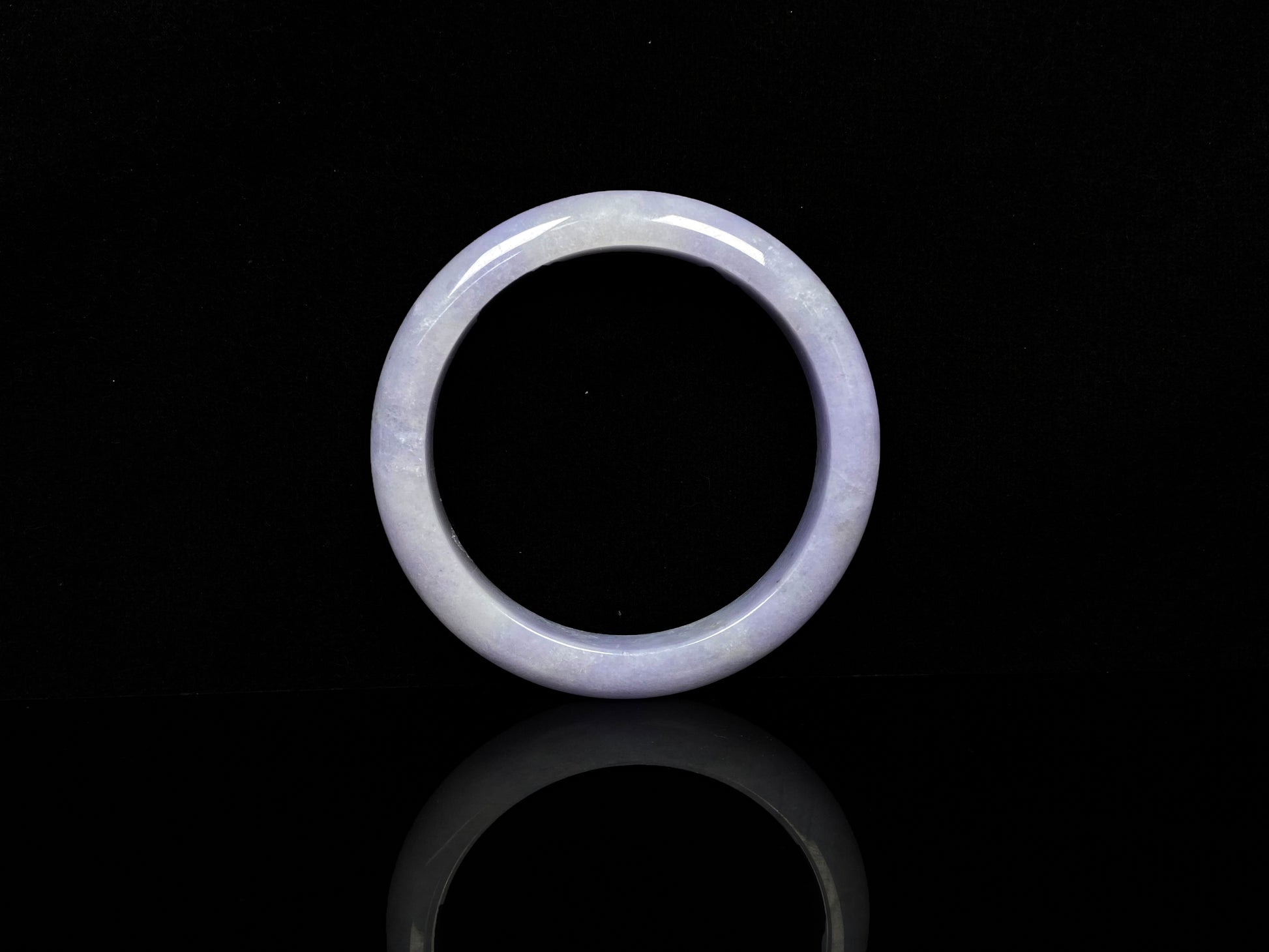 A lavender with cloud white  jadeite bangle.