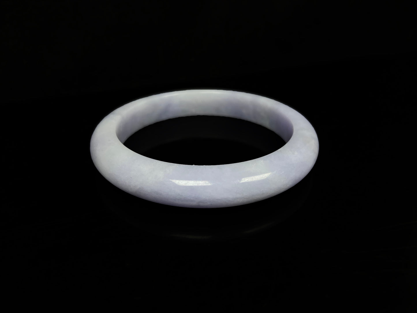 A lavender with cloud white  jadeite bangle.