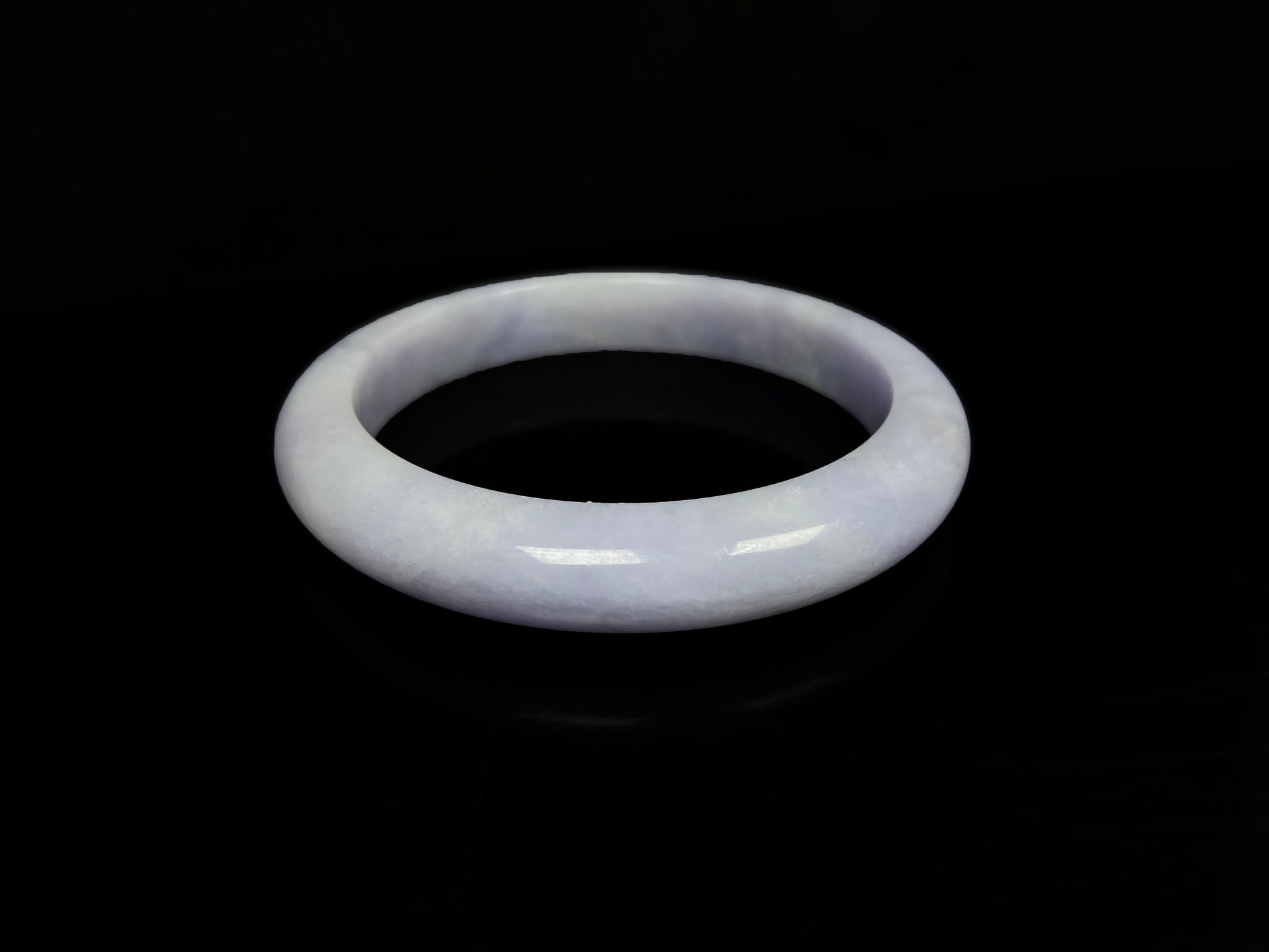 A lavender with cloud white  jadeite bangle.