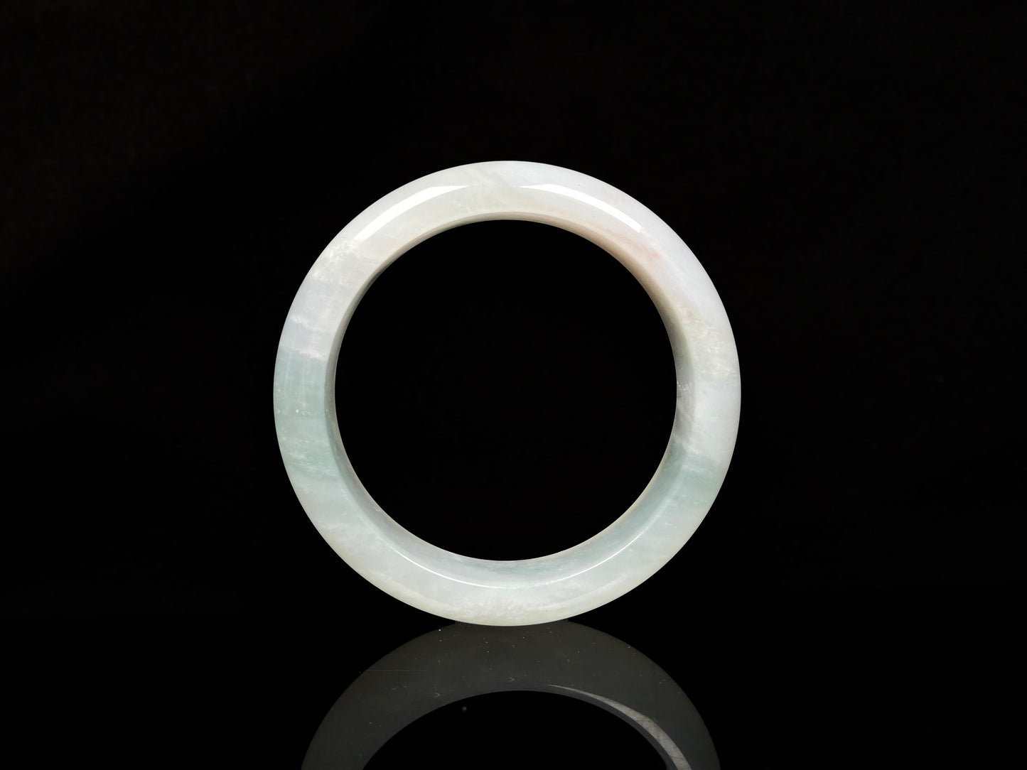 A pale azure cloud white jadeite bangle.