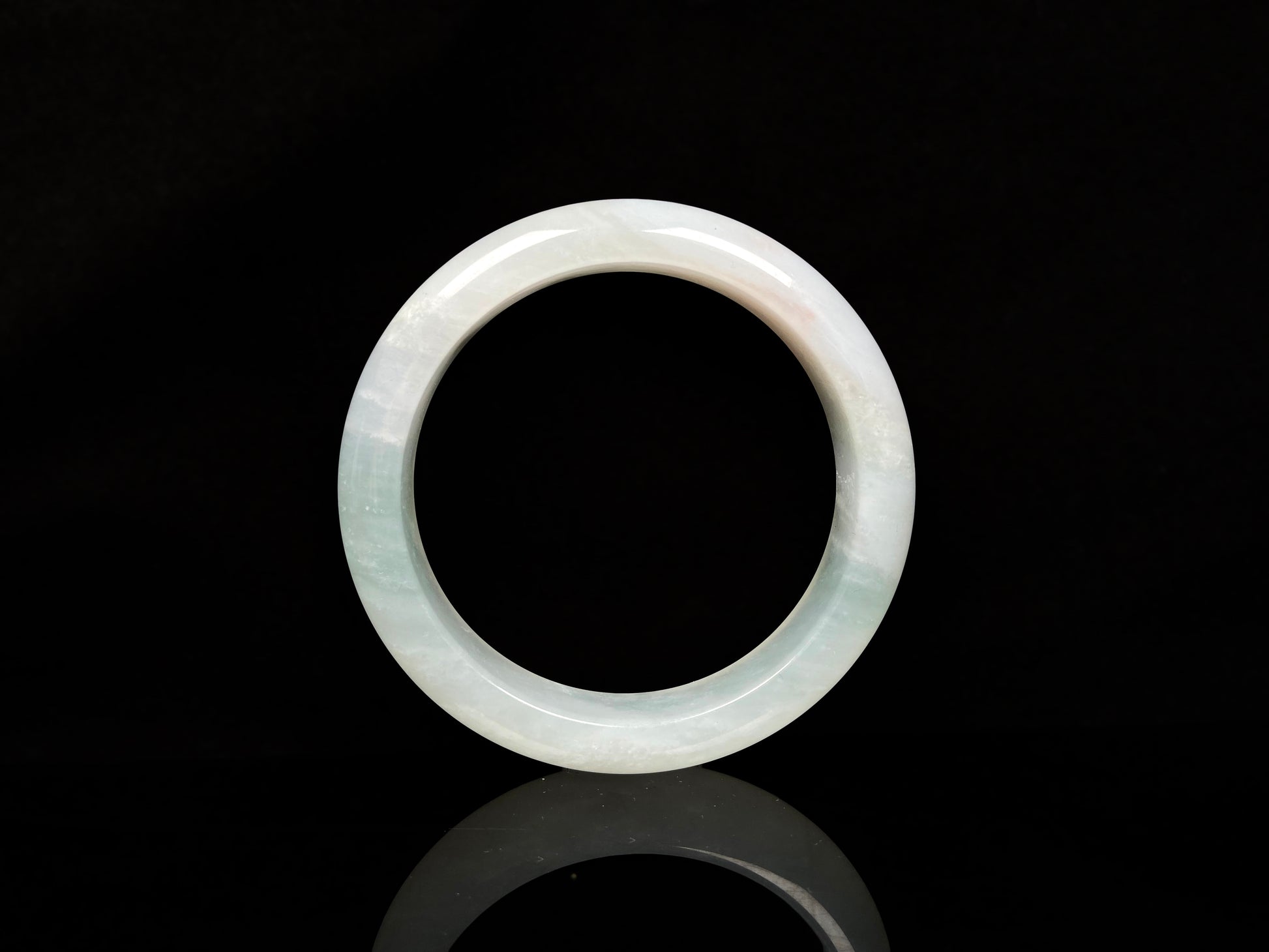 A pale azure cloud white jadeite bangle.