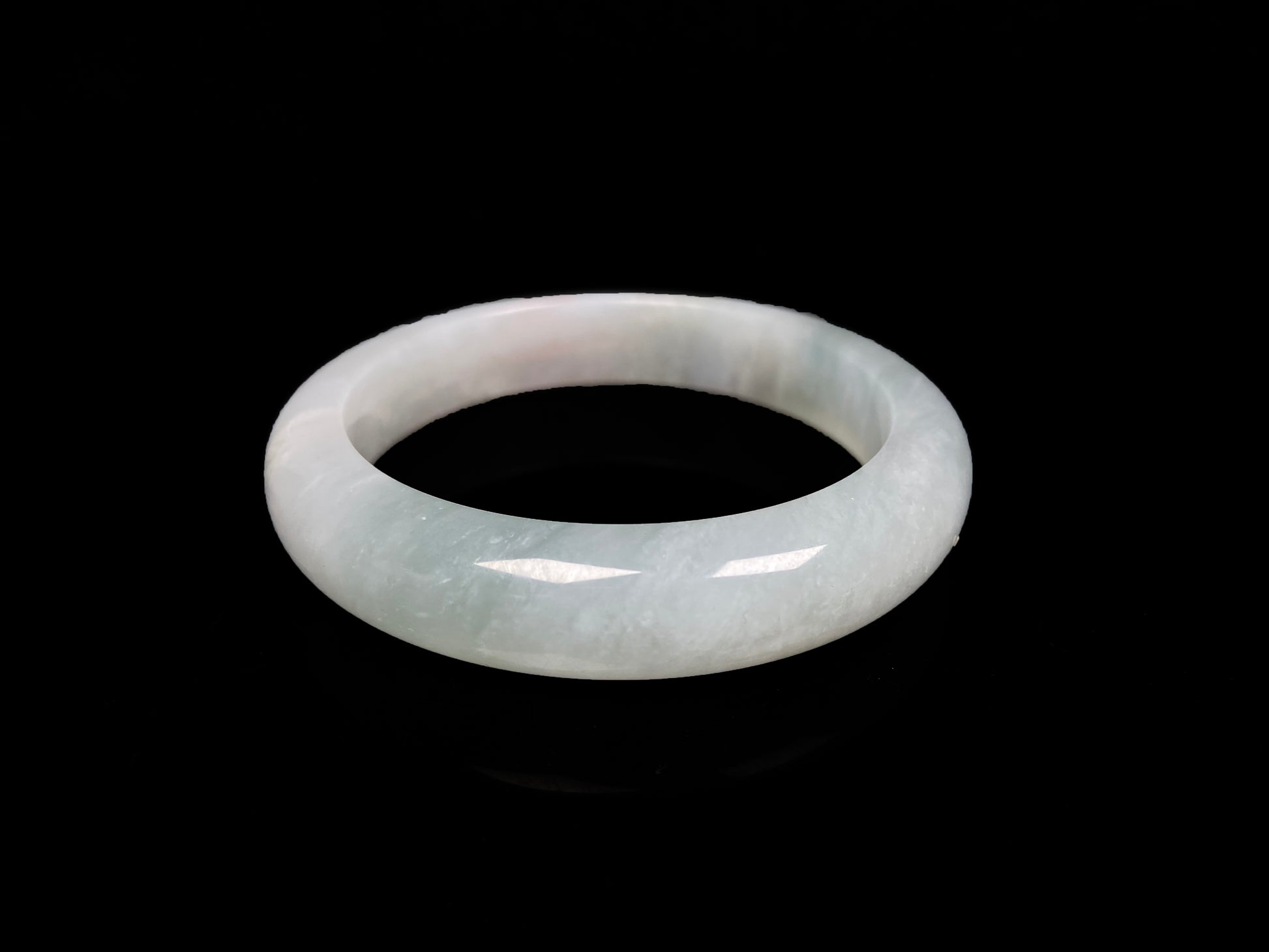 A pale azure cloud white jadeite bangle.