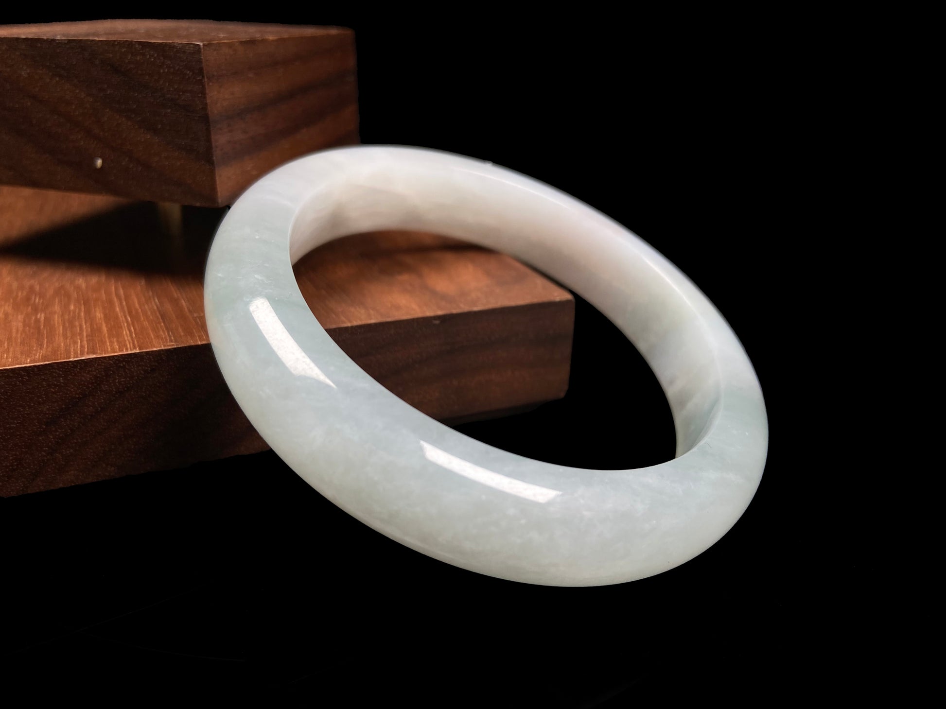 A pale azure cloud white jadeite bangle.
