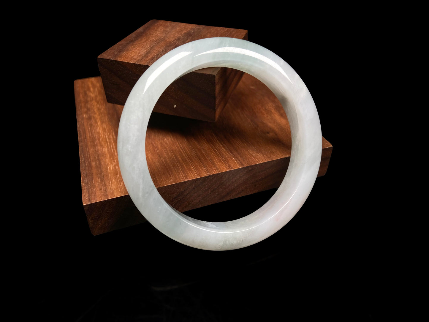 A pale azure cloud white jadeite bangle.