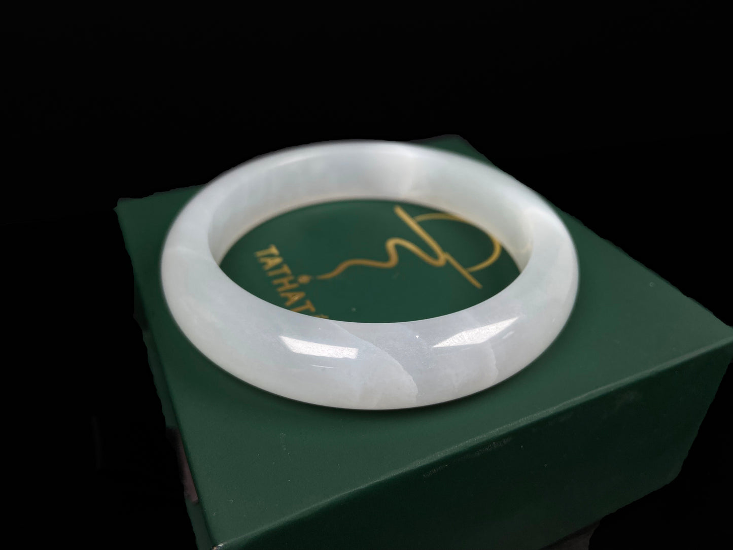 A pure milky white jadeite bangle.