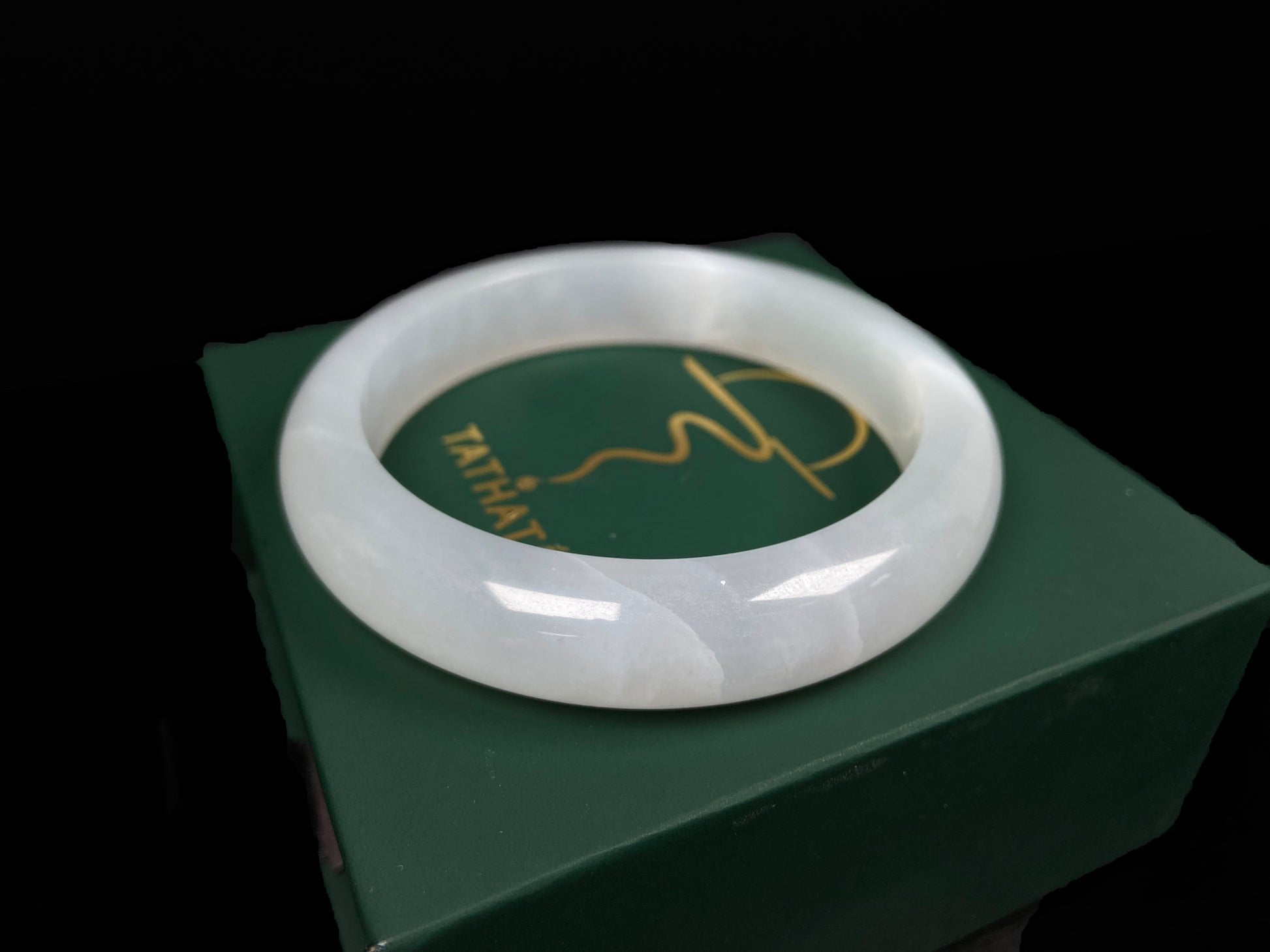 A pure milky white jadeite bangle.