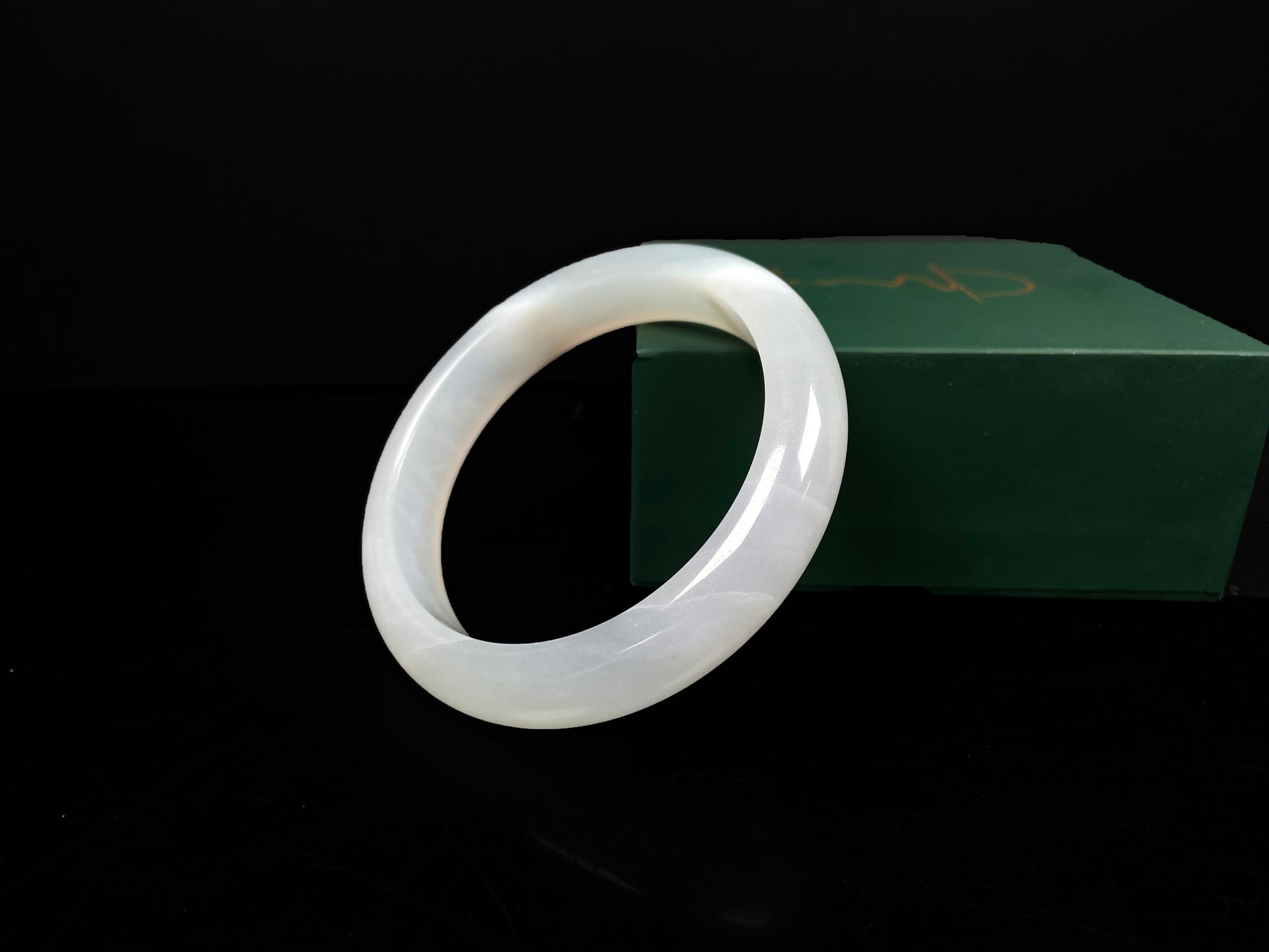 A pure milky white jadeite bangle.