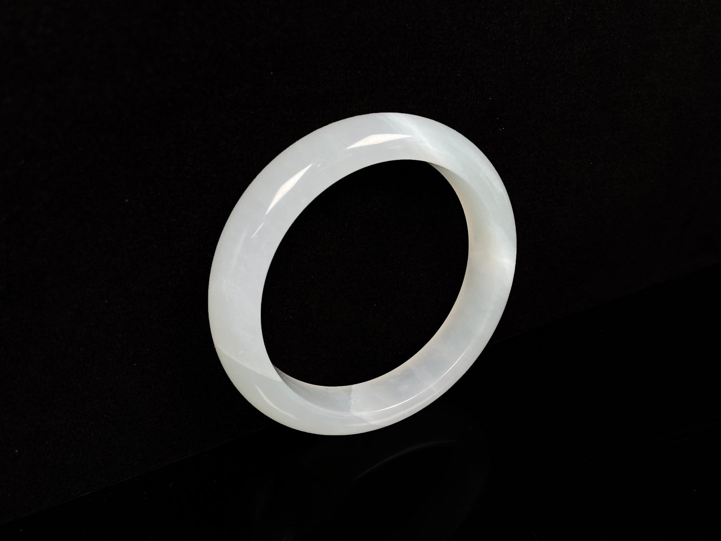 A pure milky white jadeite bangle.