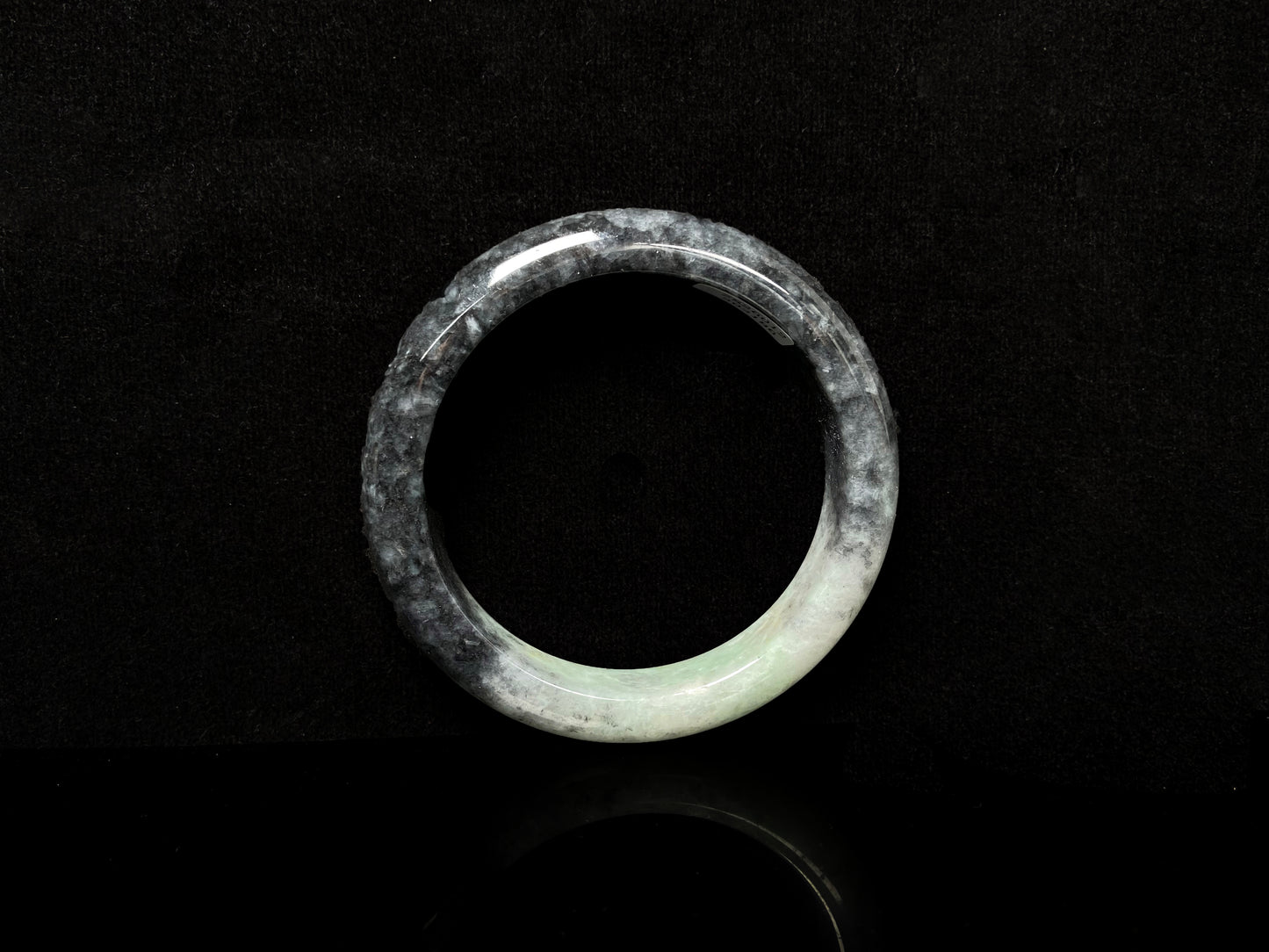 A white black jadeite bangle.