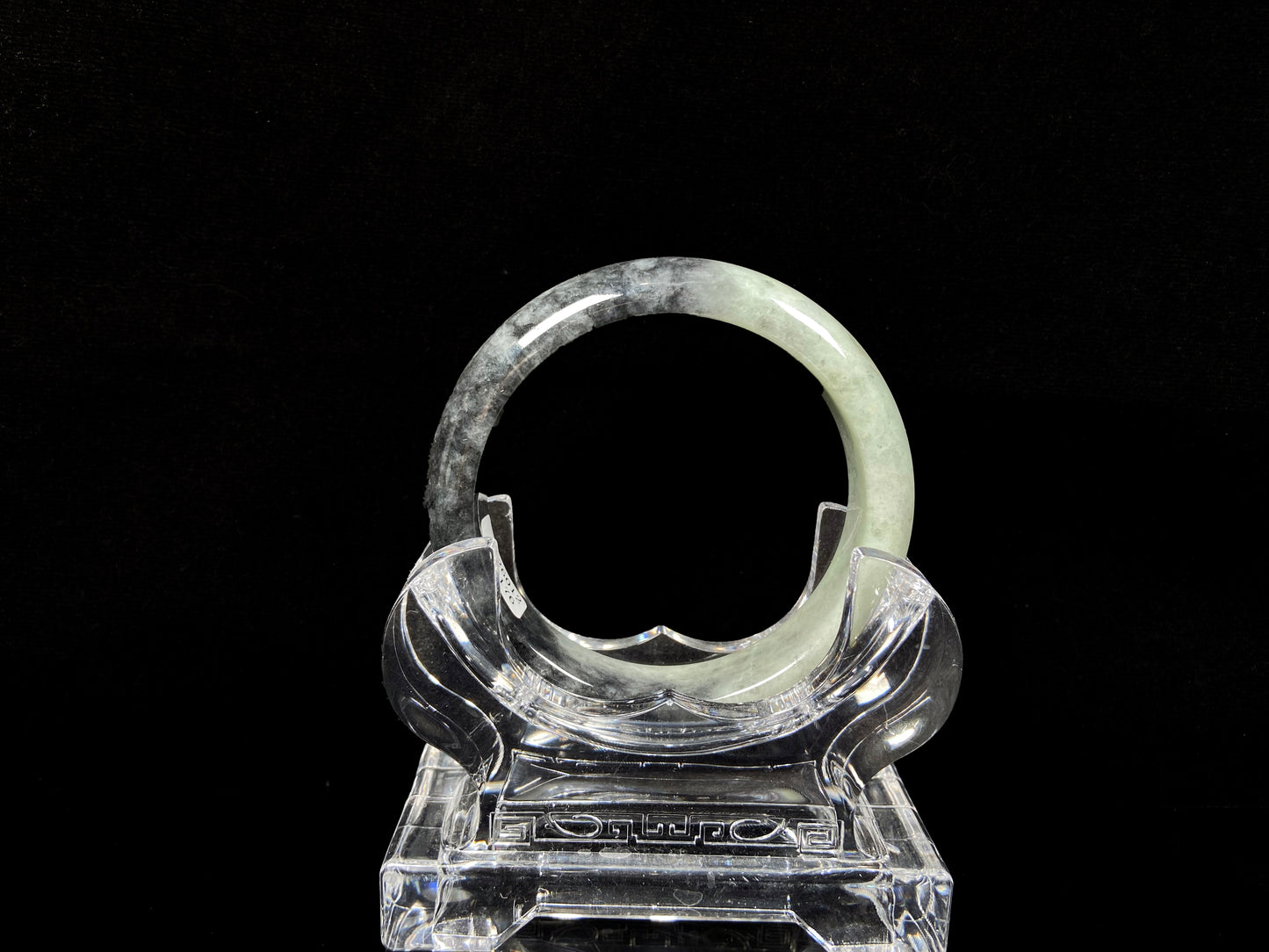 A half ink half green jadeite bangle.