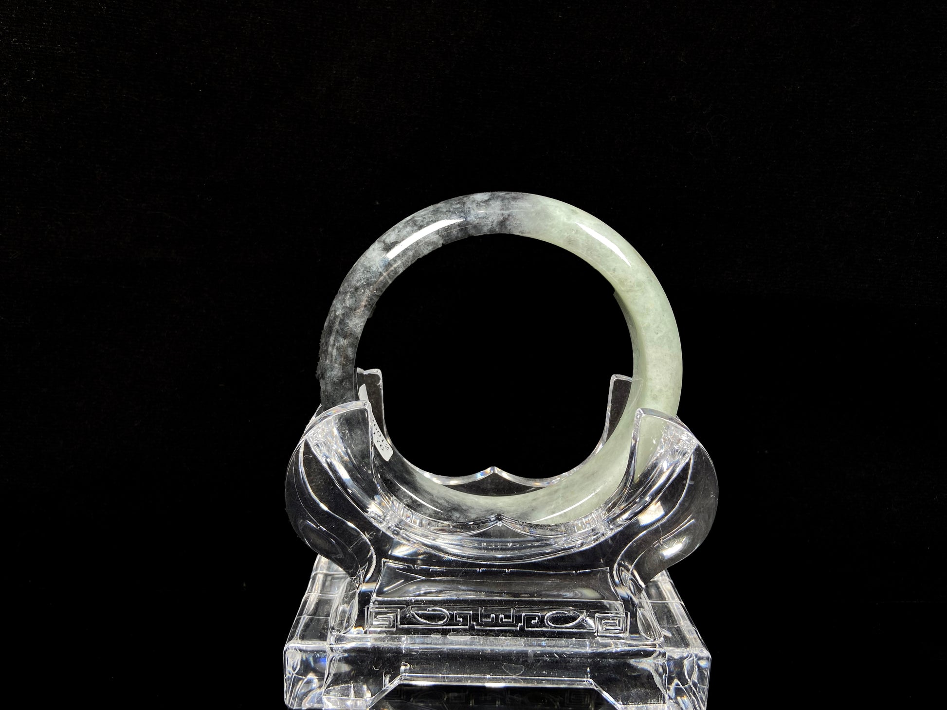 A half ink half green jadeite bangle.