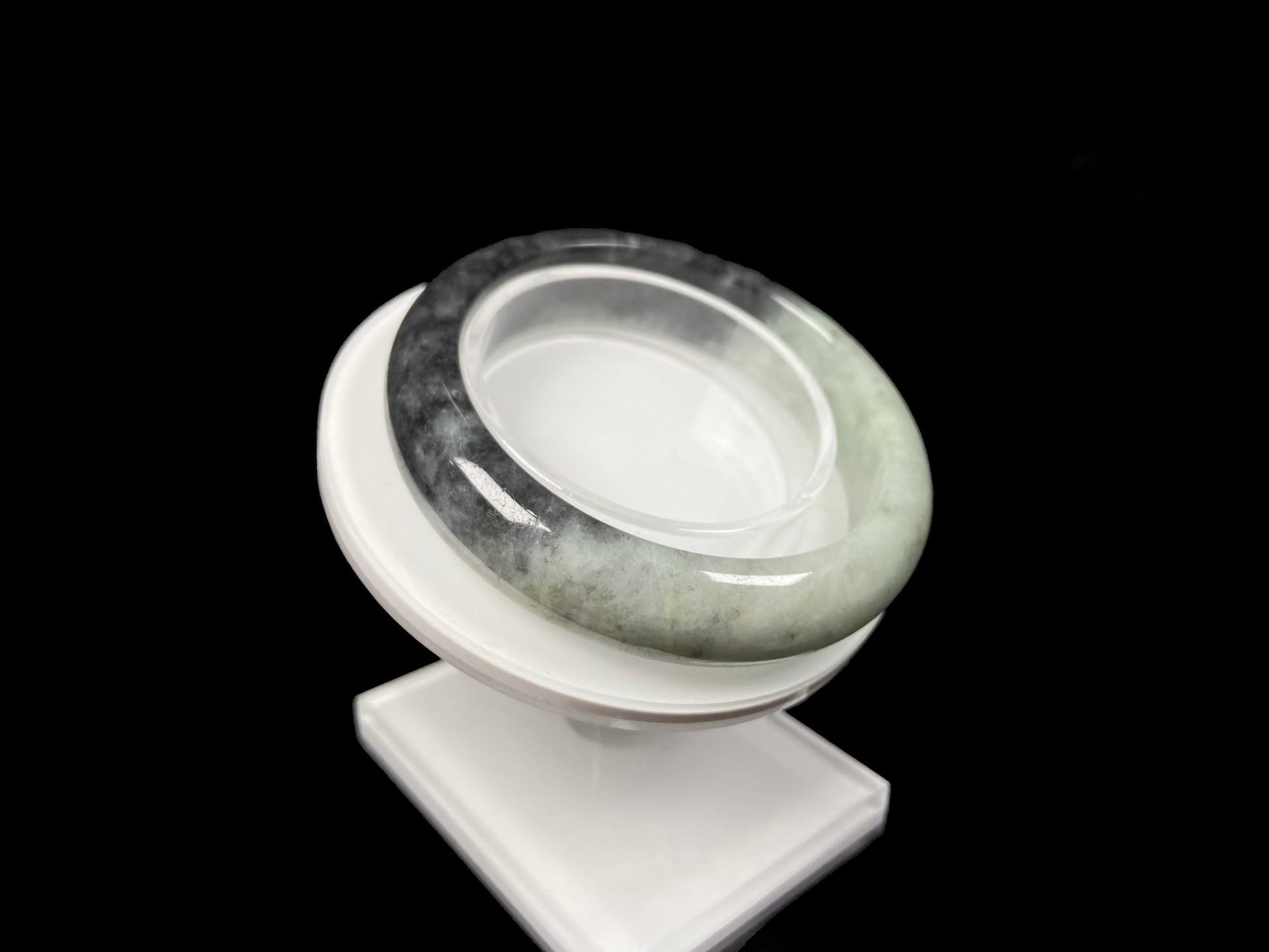 A half ink half green jadeite bangle.