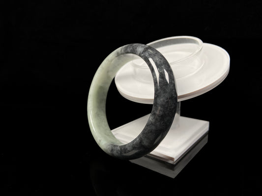 A half ink half green jadeite bangle.