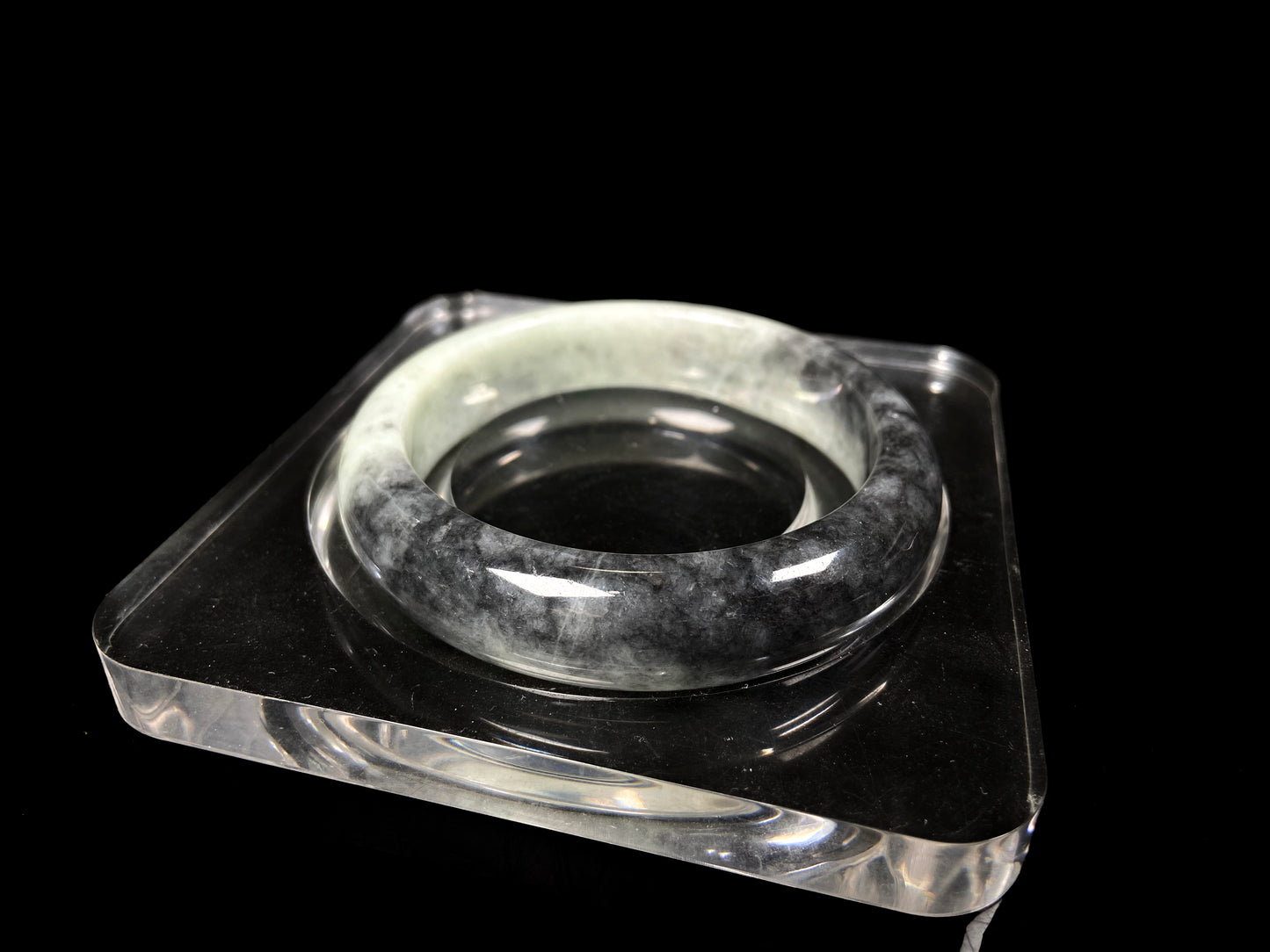 A half ink half green jadeite bangle.