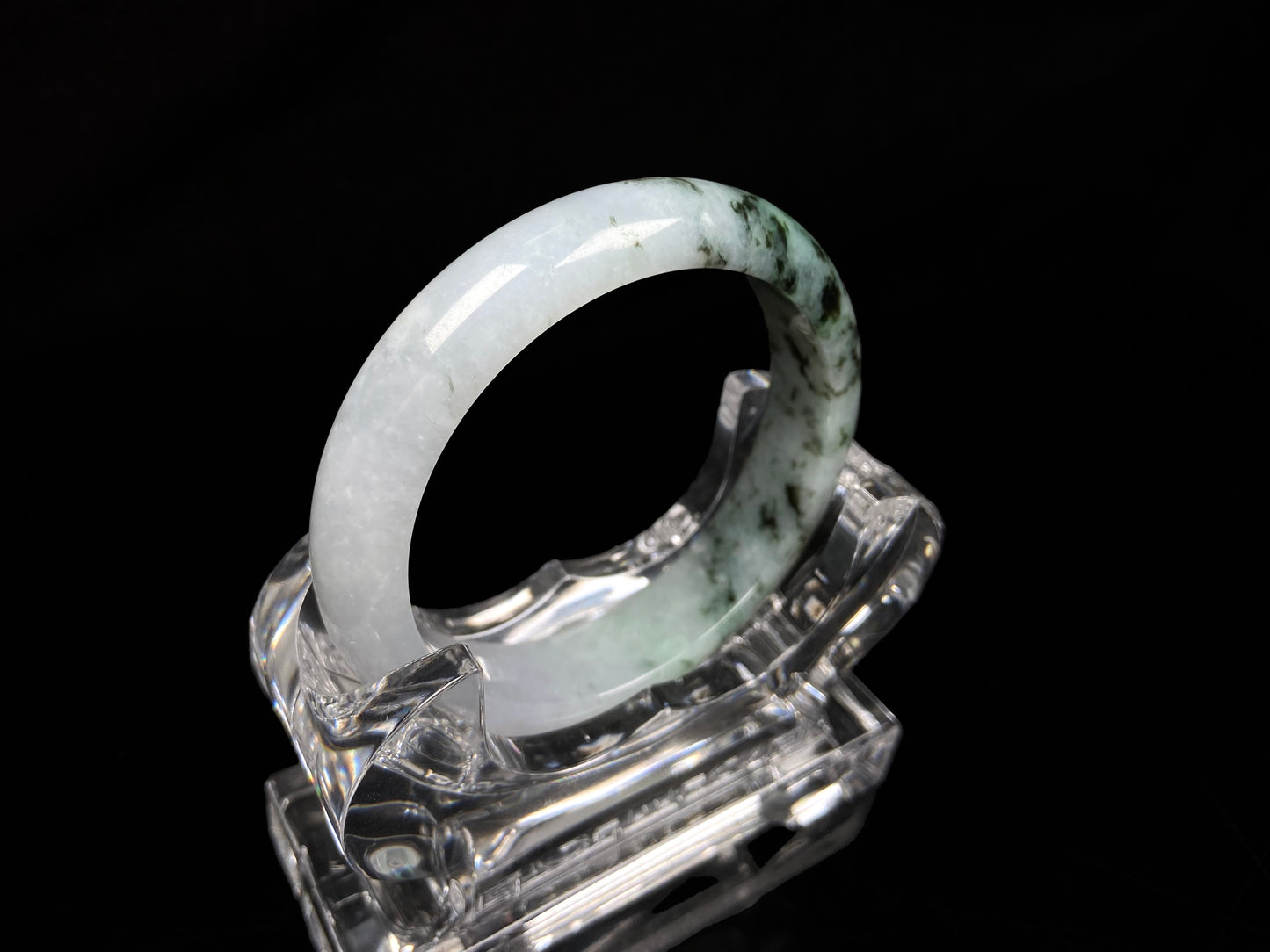 A misty green peaks jadeite bangle.