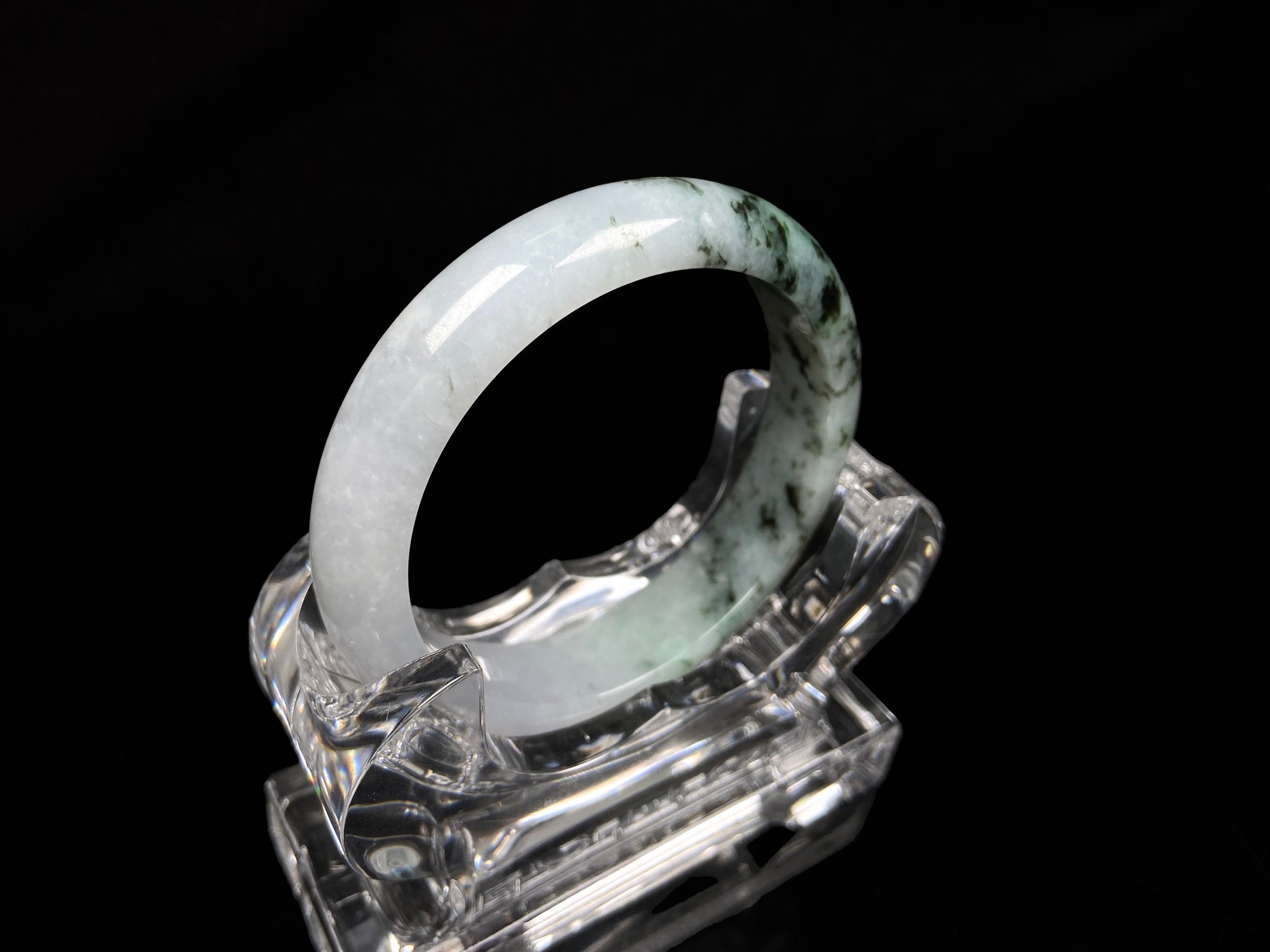 A misty green peaks jadeite bangle.