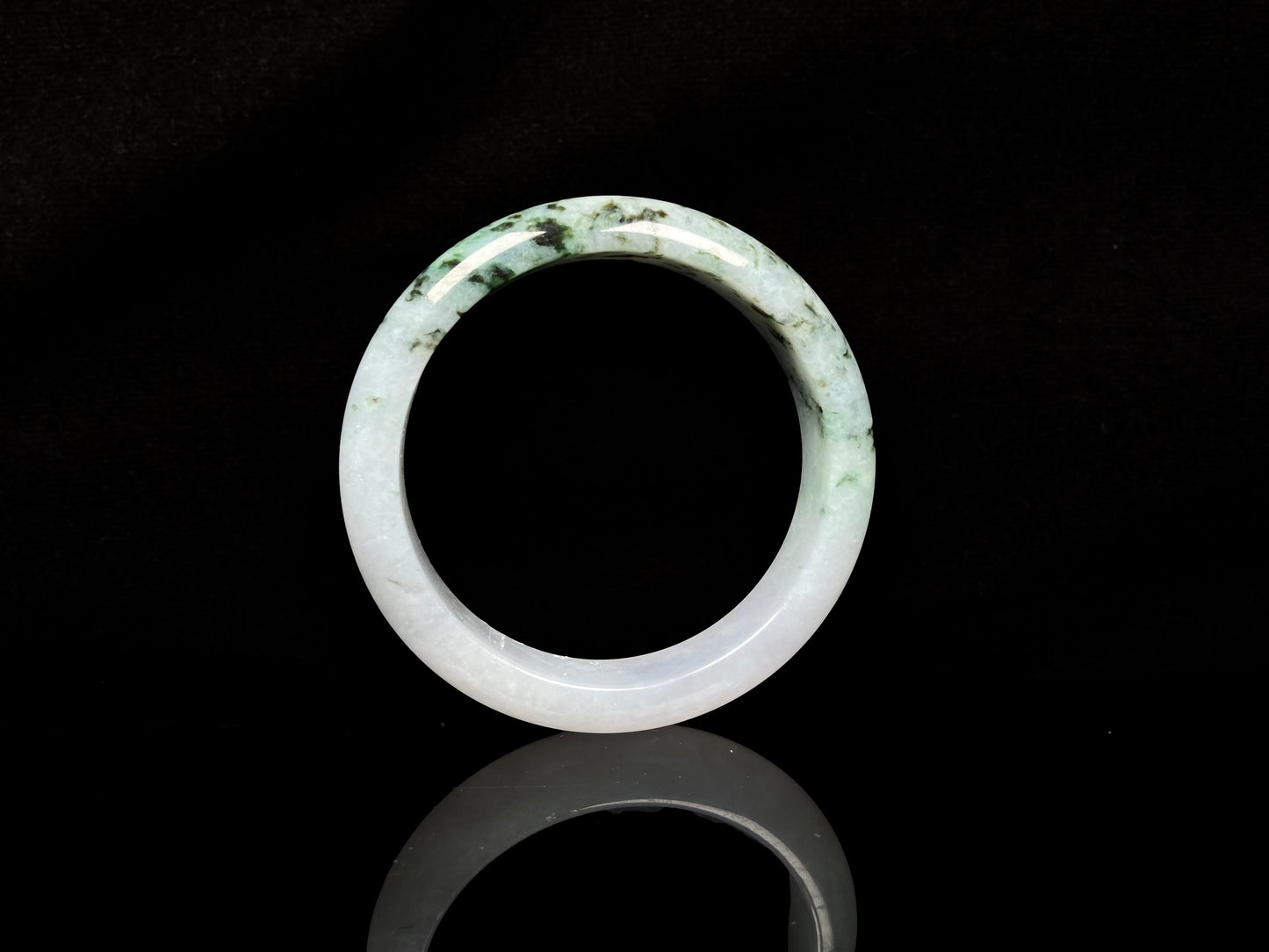 A misty green peaks jadeite bangle.