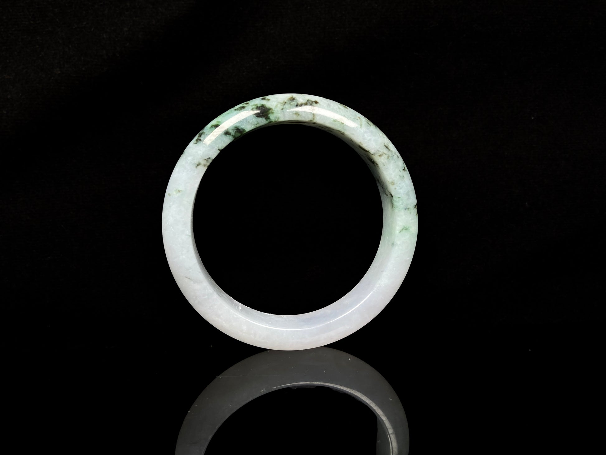 A misty green peaks jadeite bangle.