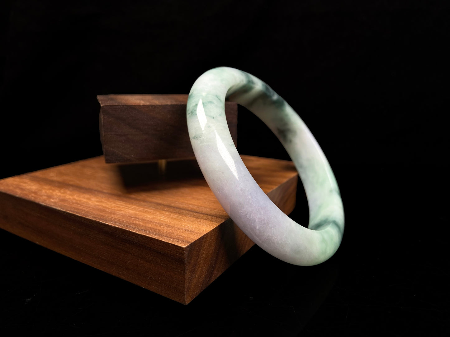 A misty green lavender jadeite bangle.